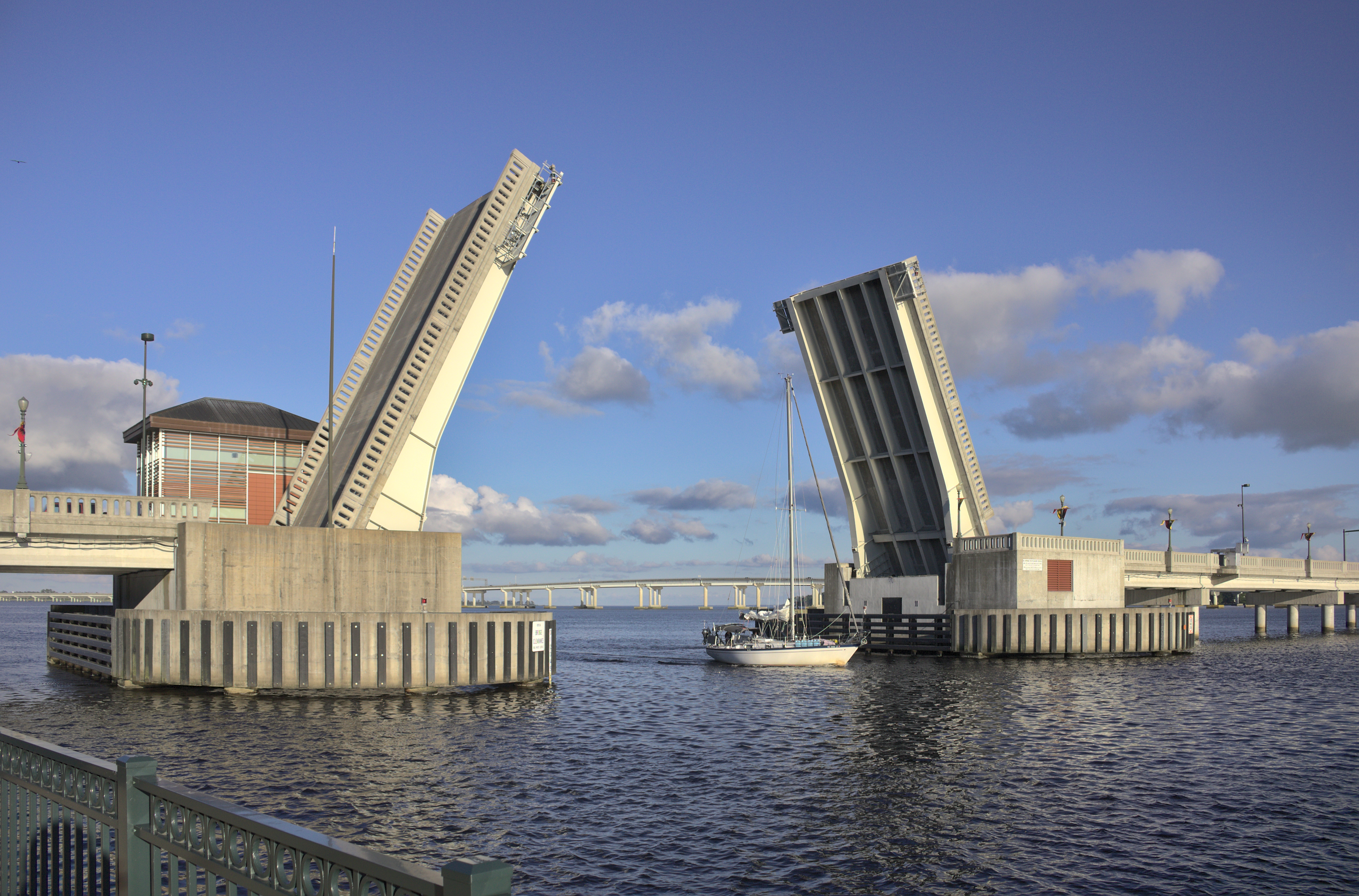 An open drawbridge and sailboat viewed from Union Point Park in 2020.